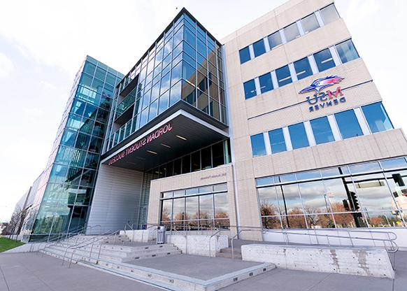 Street shots of the new MSU Denver sign on the Jordan Student Success Building facing the Pepsi Center.