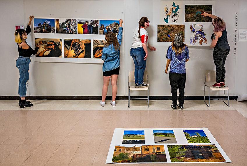 Students hanging images