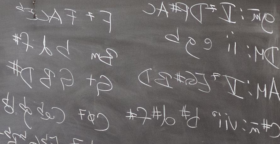 Music theory writing on a chalkboard