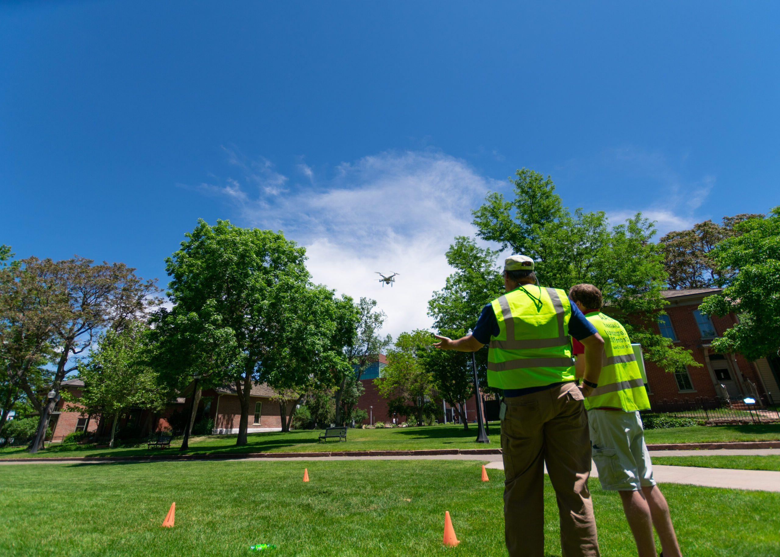 Josh Noel, program coordinator, and Alex Toussaint, aeronautics technician specialist, do aerial drone mapping of the 9th Street Park.